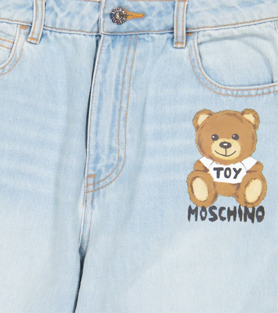 Shop Moschino Logo Jeans In Light Blue
