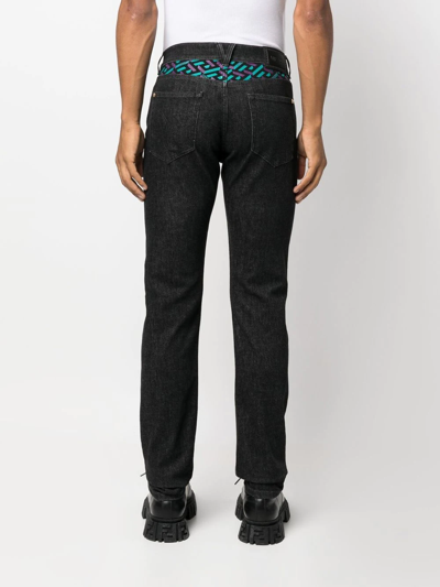 Shop Versace La Greca Straight-leg Jeans In Schwarz
