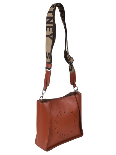 Shop Stella Mccartney Mini Logo Perforated Crossbody Bag In Sierra