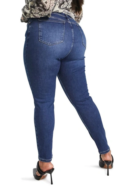 Shop Asos Design Curve Edit Super Power Skinny Jeans In Medium Blue
