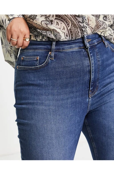 Shop Asos Design Curve Edit Super Power Skinny Jeans In Medium Blue