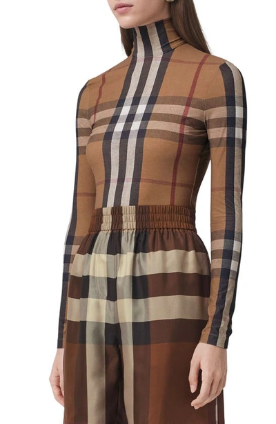 Shop Burberry Emery Check Turtleneck Top In Birch Brown Ip Chk