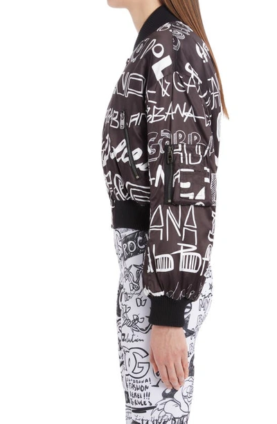 Shop Dolce & Gabbana Graffiti Logo Crop Bomber Jacket In Hnsfw Logo4 Bco Fdo Nero