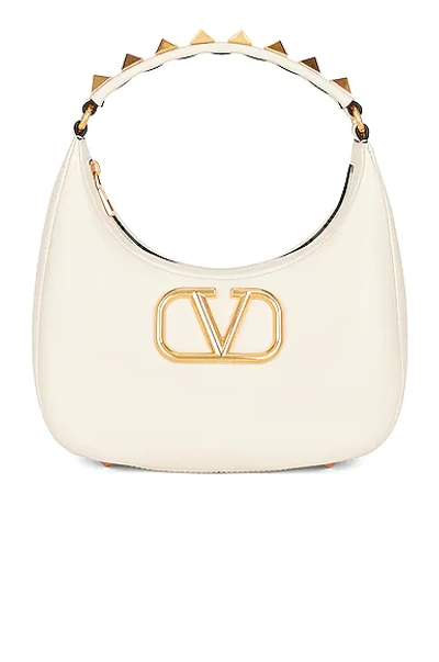 Shop Valentino Stud Sign Hobo Bag In Light Ivory