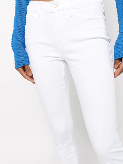 Shop Frame Le High Slim-fit Jeans In White
