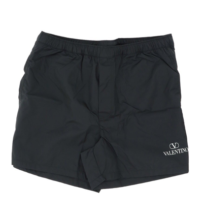 Shop Valentino Logo Printed High Waist Swim Shorts In Black