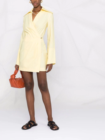 Shop Nanushka Open-back Mini Wrap Dress In Yellow