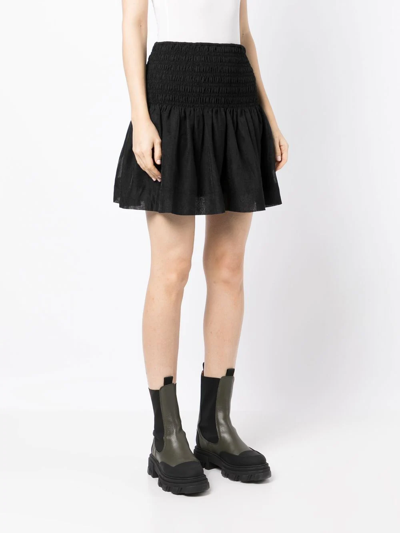 Shop Ganni Crinkled Georgette Smocked Mini-skirt In Schwarz