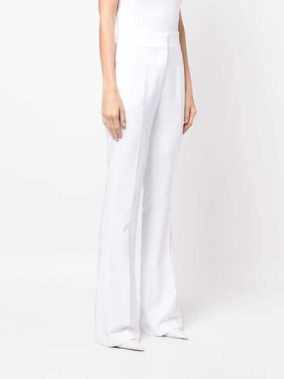 Shop Genny High-waisted Flared Trousers In Weiss