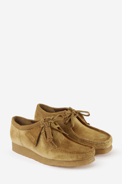 Shop Clarks Wallabee Shoes In Brown