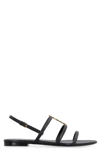 Shop Saint Laurent Cassandra Leather Flat Sandals In Black