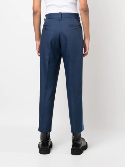 Shop Viktor & Rolf Embroidered-logo Cropped Trousers In Blue
