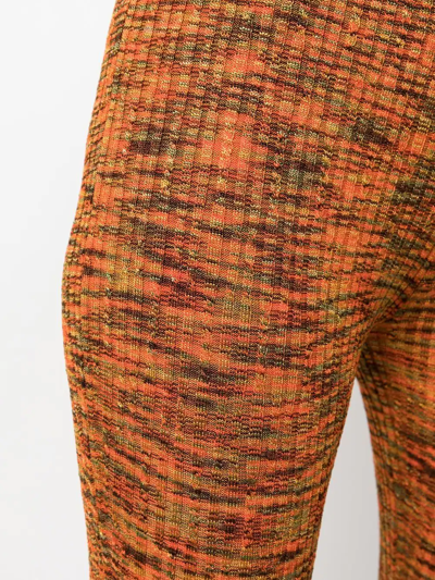 Shop Acne Studios Bootcut Ribbed-knit Trousers In Orange