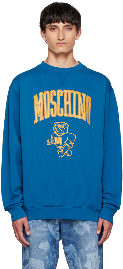 Shop Moschino Blue Varsity Sweatshirt In A1320 Fantasy Print