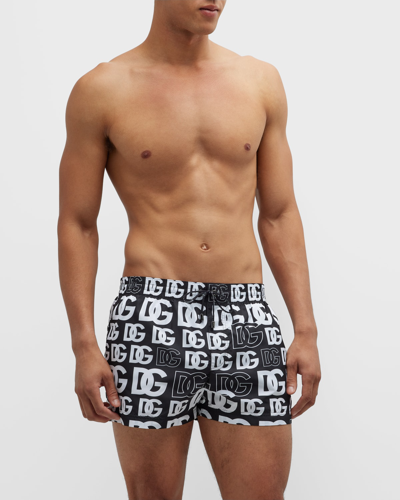 Shop Dolce & Gabbana Men's Allover-dg Swim Shorts In Black/white Print
