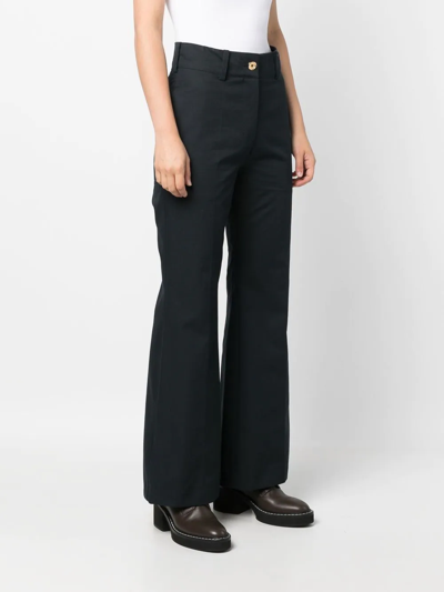 Shop Patou High-waisted Flared Trousers In Blue