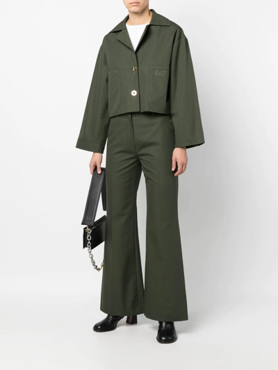 Shop Patou Logo-embroidered Flared Trousers In Green