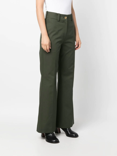 Patou Logo-embroidered Flared Trousers In Green