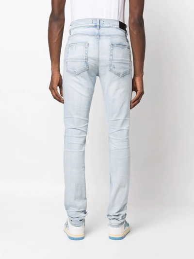 Amiri Distressed Slim-cut Jeans In Blue