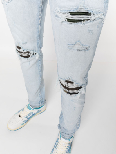 Amiri Distressed Slim-cut Jeans In Blue