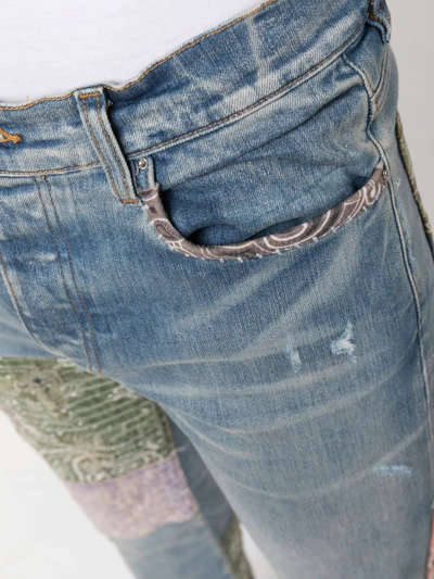 Shop Amiri Distressed Patchwork Skinny Jeans In Blue