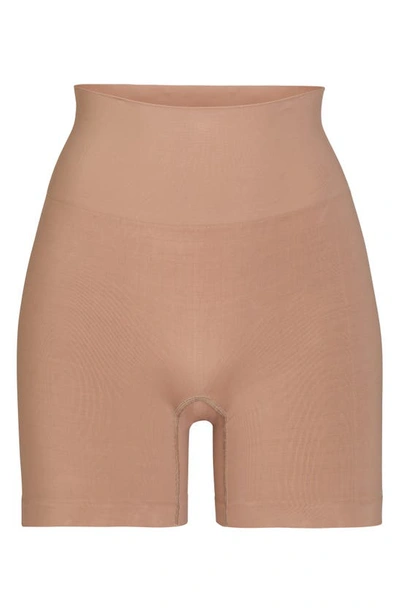 Shop Skims Soft Smoothing Seamless Shorts In Sienna