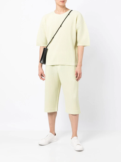 Shop Issey Miyake Tailored Pleated Shorts In Yellow