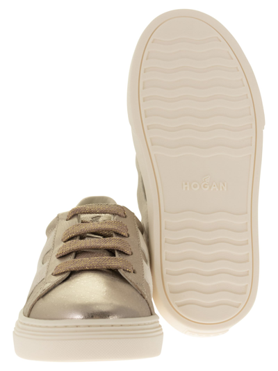 Shop Hogan H365 - Sneakers In Glod/pink