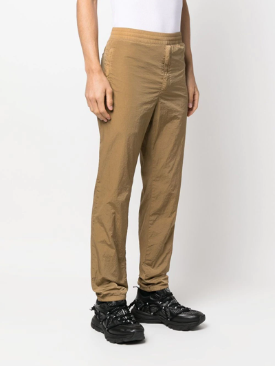 Shop Givenchy Slim-cut Elasticated-waistband Trousers In Brown