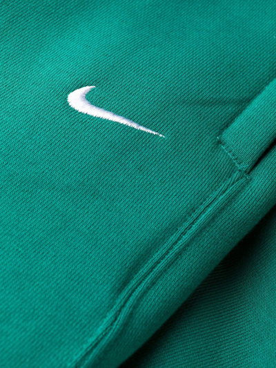 Shop Nike Swoosh Logo Track Pants In Green