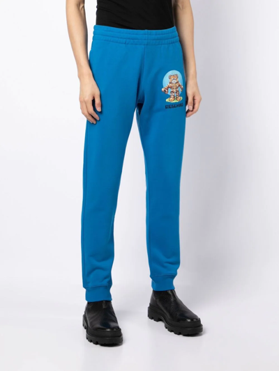 Shop Moschino Logo-print Cotton Track Pants In Blau