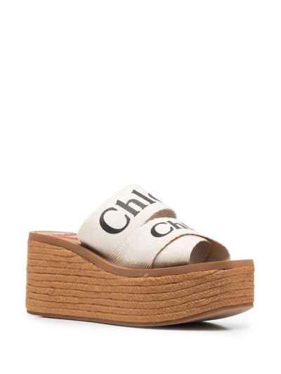 Shop Chloé Woody Canvas Wedge Mules In White