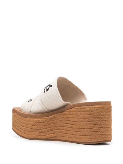 Shop Chloé Woody Canvas Wedge Mules In White