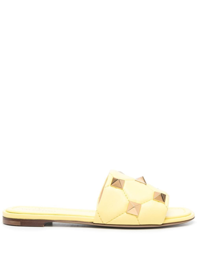 Shop Valentino Roman Stud Leather Flat Sandals In Yellow