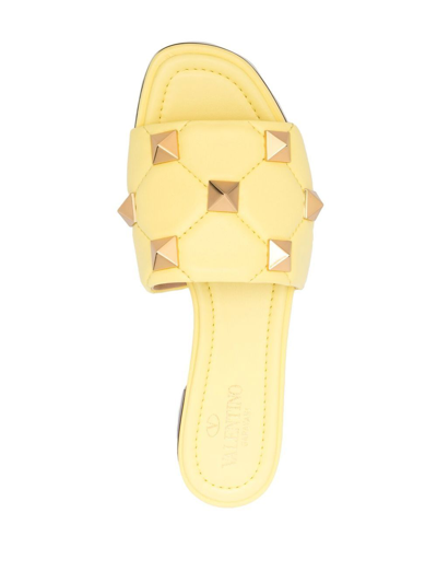 Shop Valentino Roman Stud Leather Flat Sandals In Yellow