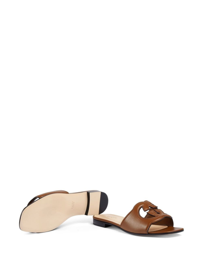 Shop Gucci Gg Cut-out Leather Flat Sandals In Brown