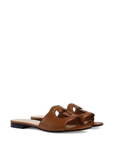Shop Gucci Gg Cut-out Leather Flat Sandals In Brown