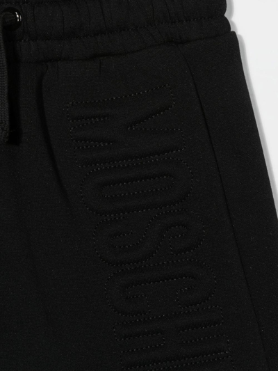 Shop Moschino Debossed-logo Detail Skirt In Black