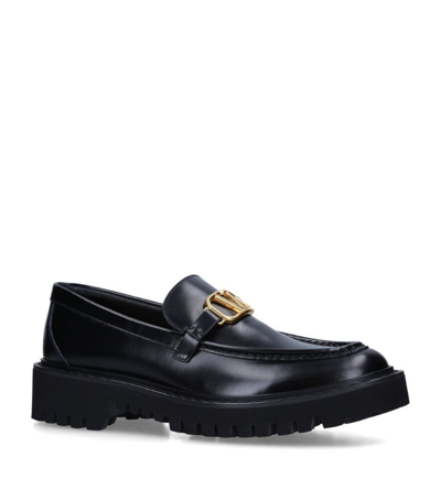 Shop Valentino Leather Signature Loafers In Black