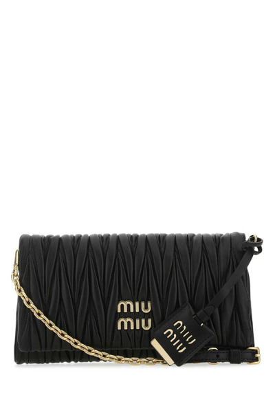 Shop Miu Miu Matelassé Logo Detailed Foldover Shoulder Bag In Black