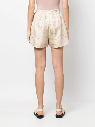 Shop Totême Monogram-print Silk Shorts In Neutrals