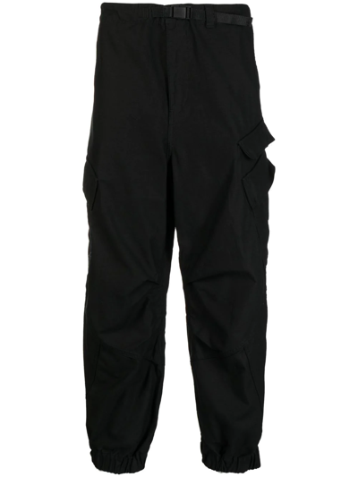 Shop Undercover Raw-cut Tapered Cargo Trousers In Black