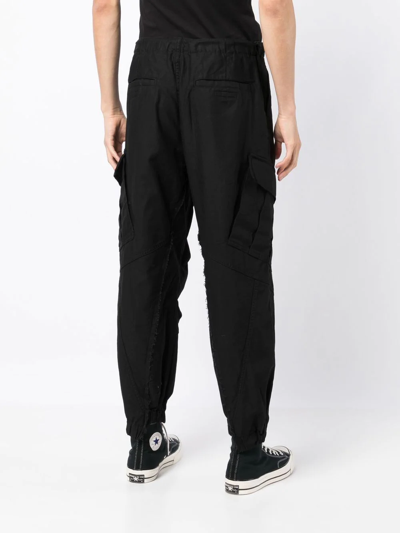 Shop Undercover Raw-cut Tapered Cargo Trousers In Black