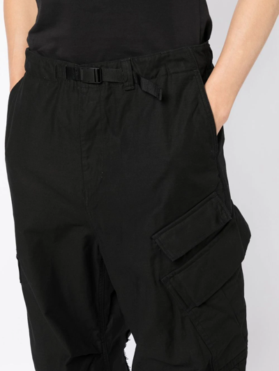 Shop Undercover Raw-cut Tapered Cargo Trousers In Black