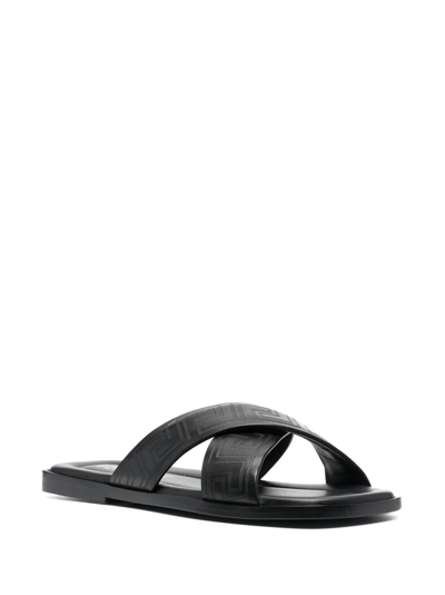Shop Versace Greca-embossed Crossover-strap Sandals In Black