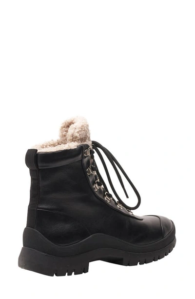Shop Andre Assous Leandra Faux Shearling Weather Resistant Bootie In Black