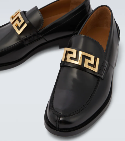 Shop Versace La Greca Leather Loafers In Nero-oro