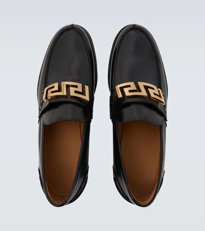 Shop Versace La Greca Leather Loafers In Nero-oro