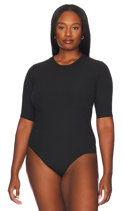 Shop Spanx Suit Yourself Ribbed Short Sleeve Bodysuit In Very Black