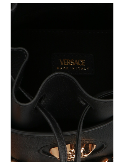 Shop Versace La Medusa Bucket Bag In V Nero